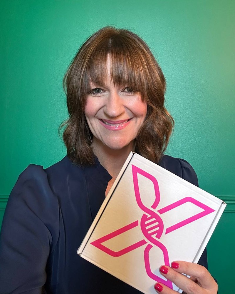 Meghan Graves, founder of MyPeptideCode, holding a ProxiGene test kit